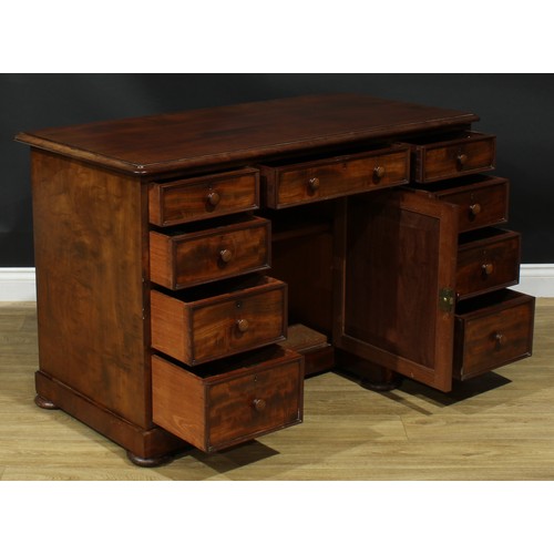 927 - A 19th century mahogany kneehole desk, rectangular top with moulded edge above an arrangement of dra... 