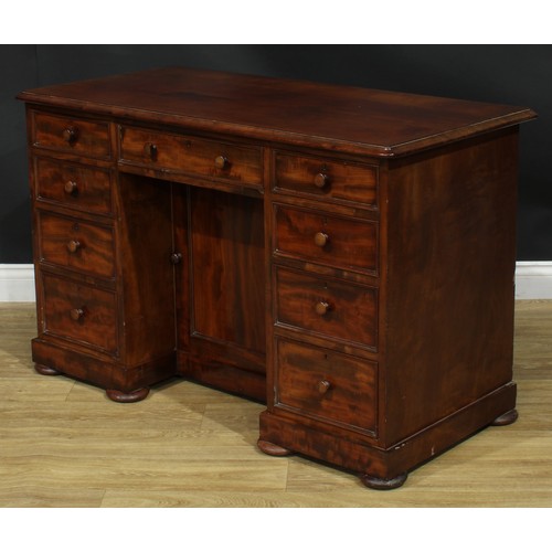 927 - A 19th century mahogany kneehole desk, rectangular top with moulded edge above an arrangement of dra... 