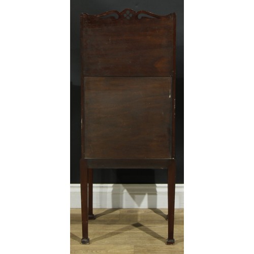 1172 - A George III Revival mahogany bedroom cabinet, shaped and pierced back above a fiddleback and flame ... 