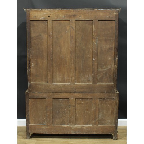 1271 - A George III oak housekeeper’s livery or provision cupboard, simulated dentil cornice above a pair o... 