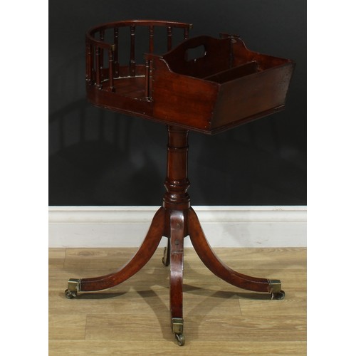 1432 - A Regency mahogany revolving butler’s plate and cutlery stand, turned column, sabre legs, brass capp... 