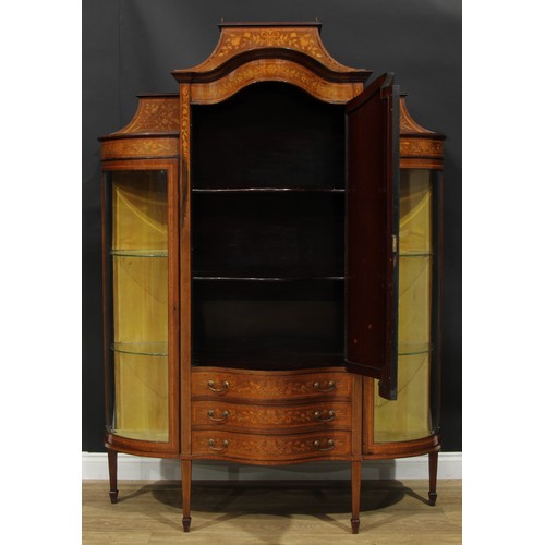 1136 - A Sheraton Revival satinwood banded mahogany and marquetry display cabinet, caddy top above a serpen... 