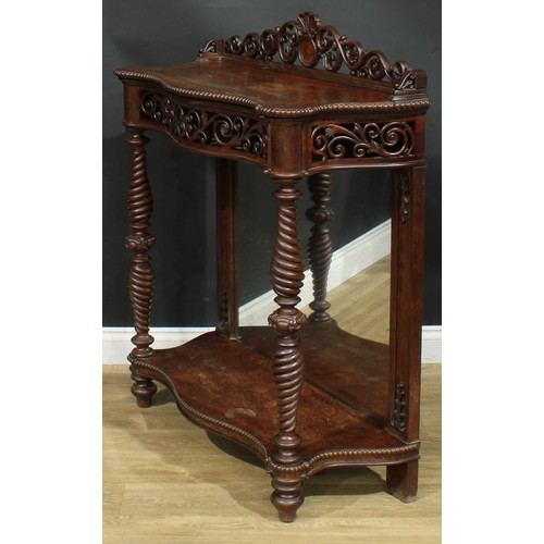 904 - A 19th century hardwood serpentine pier table, shaped cresting above a removable upper plateau enclo... 