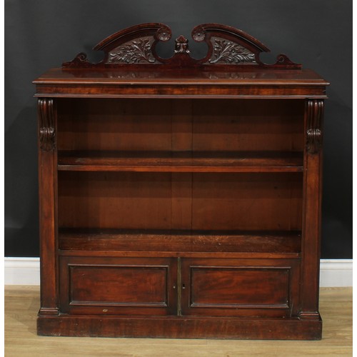 931 - A 19th century mahogany pier bookcase, rectangular top with swan neck half-galley above a shelf and ... 