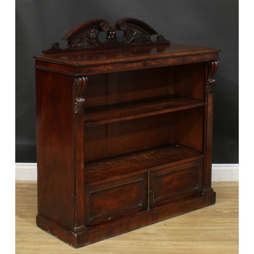 931 - A 19th century mahogany pier bookcase, rectangular top with swan neck half-galley above a shelf and ... 