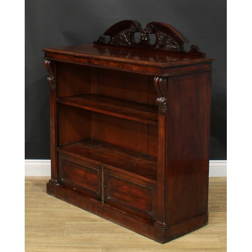 931 - A 19th century mahogany pier bookcase, rectangular top with swan neck half-galley above a shelf and ... 