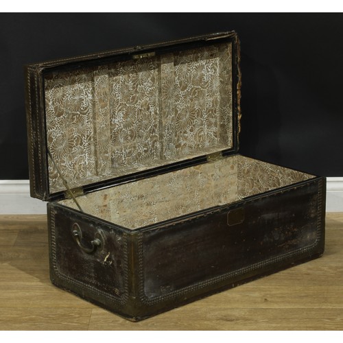 890 - A 19th century brass mounted and studded leather-bound chest, hinged cover with rectangular plaque i... 