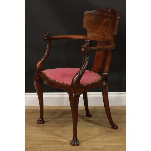 910 - A 19th century mahogany and marquetry elbow chair, curved cresting rail inlaid with a ribbon-tied la... 