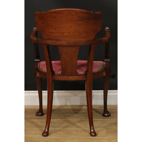 910 - A 19th century mahogany and marquetry elbow chair, curved cresting rail inlaid with a ribbon-tied la... 