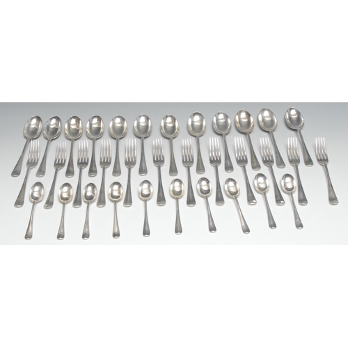 53 - A George V silver Hanoverian rat tail pattern part table service, comprising twelve dessert spoons, ... 