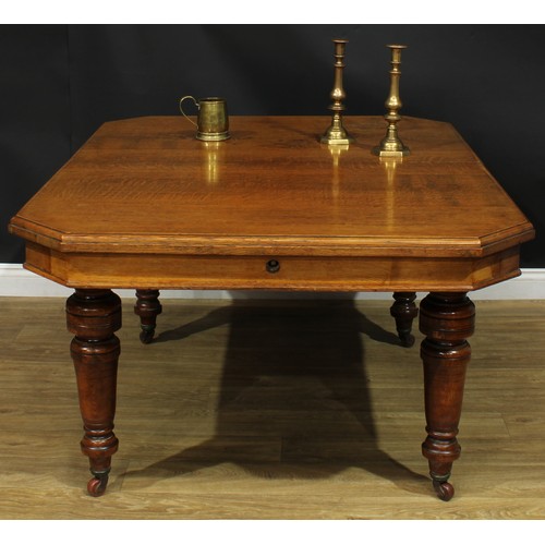 1336 - A late Victorian oak dining table, canted rectangular top, turned legs, ceramic casters, 74cm high, ... 