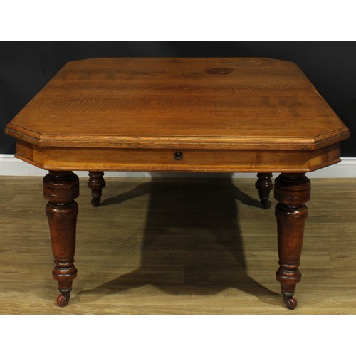 1336 - A late Victorian oak dining table, canted rectangular top, turned legs, ceramic casters, 74cm high, ... 