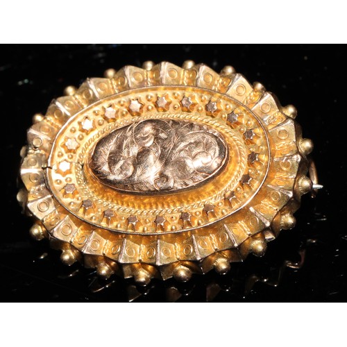 348 - A late 19th century 9ct gold oval target brooch, 3cm, steel pin, marked 9ct, 2.5g; a 10ct gold plate... 