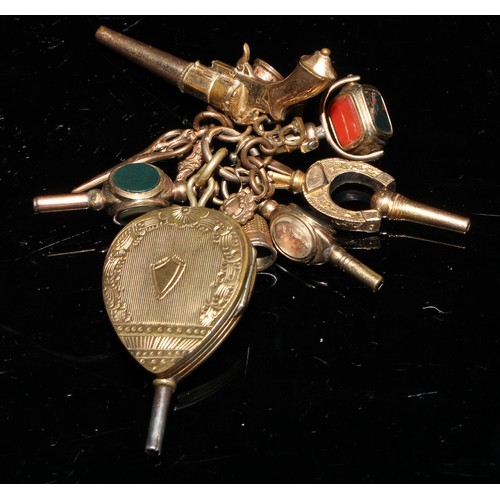 816 - A 19th century gold plated pocket watch key, as a pair of bellows, hand chased and engraved, opening... 