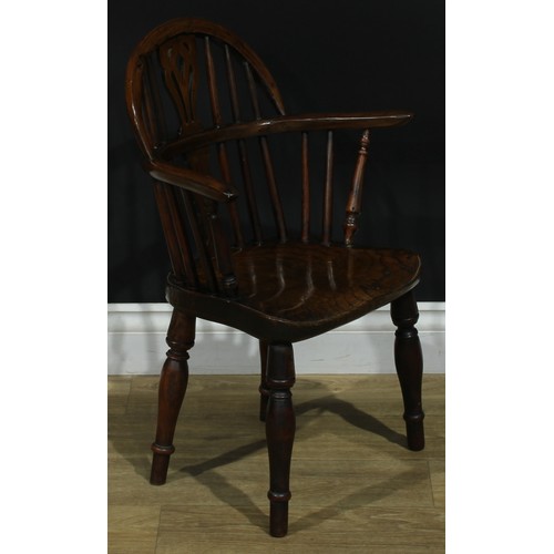 1008 - A 19th century yew and elm miniature Windsor elbow chair, hoop back, shaped and pierced splat, turne... 