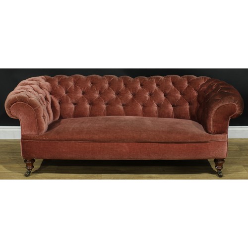 1458 - A Victorian Chesterfield sofa, stuffed-over upholstery, deep-button back, scroll arms, turned forele... 