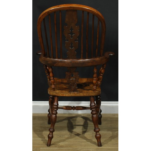 1369 - A near set of four 19th century Yorkshire yew and elm Windsor elbow chairs, each with a hoop back, s... 