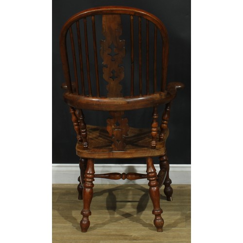 1369 - A near set of four 19th century Yorkshire yew and elm Windsor elbow chairs, each with a hoop back, s... 