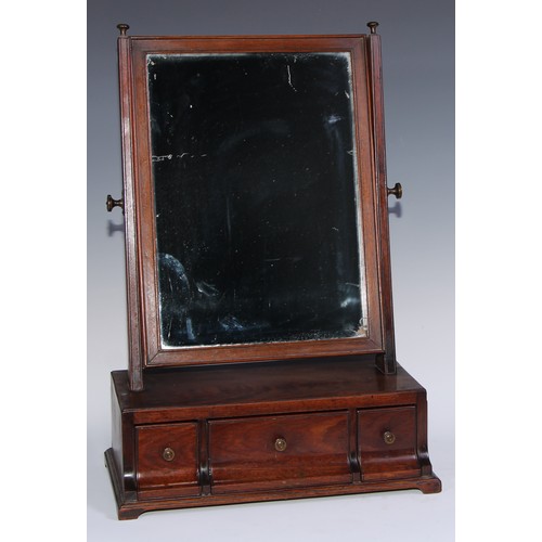 1218 - A George III mahogany dressing glass, rectangular mirror plate, the base with three drawers, shallow... 