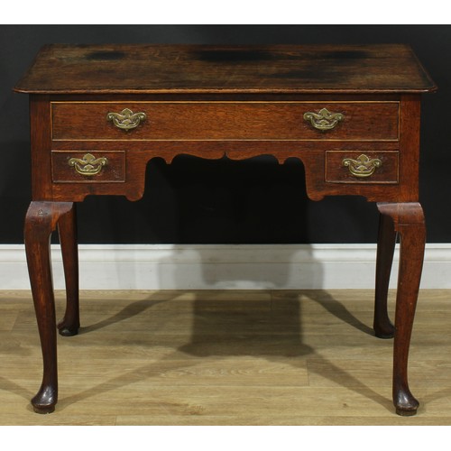 1163 - A George III oak lowboy or side table, rectangular top above one long and two small cockbeaded drawe... 