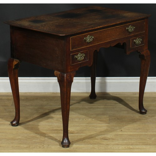 1163 - A George III oak lowboy or side table, rectangular top above one long and two small cockbeaded drawe... 