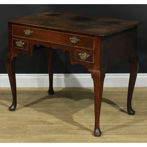 1163 - A George III oak lowboy or side table, rectangular top above one long and two small cockbeaded drawe... 