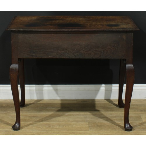 1163 - A George III oak lowboy or side table, rectangular top above one long and two small cockbeaded drawe... 