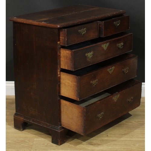 1089 - A George I/II oak chest, of small proportions, slightly oversailing top above two short and three lo... 