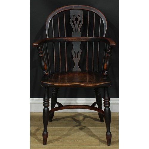 1374 - A pair of 19th century yew, elm and ash Windsor elbow chairs, each with a low hoop back, shaped and ... 