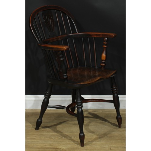 1374 - A pair of 19th century yew, elm and ash Windsor elbow chairs, each with a low hoop back, shaped and ... 