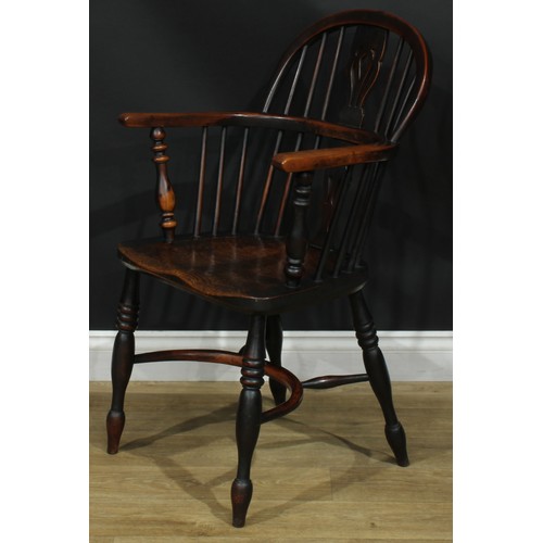 1374 - A pair of 19th century yew, elm and ash Windsor elbow chairs, each with a low hoop back, shaped and ... 