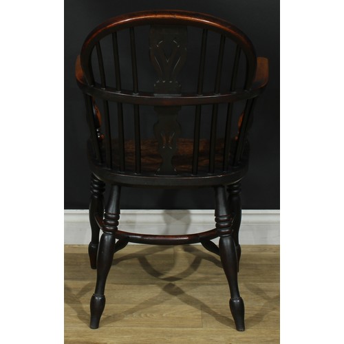 1374 - A pair of 19th century yew, elm and ash Windsor elbow chairs, each with a low hoop back, shaped and ... 