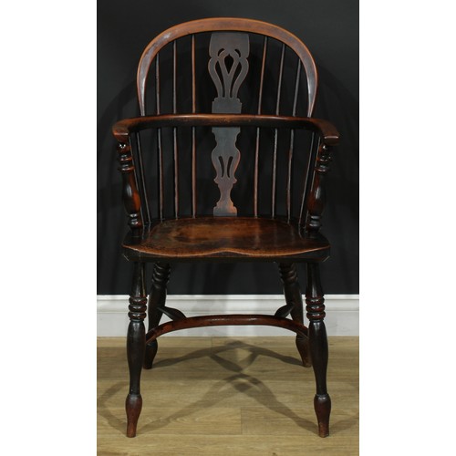 1374 - A pair of 19th century yew, elm and ash Windsor elbow chairs, each with a low hoop back, shaped and ... 