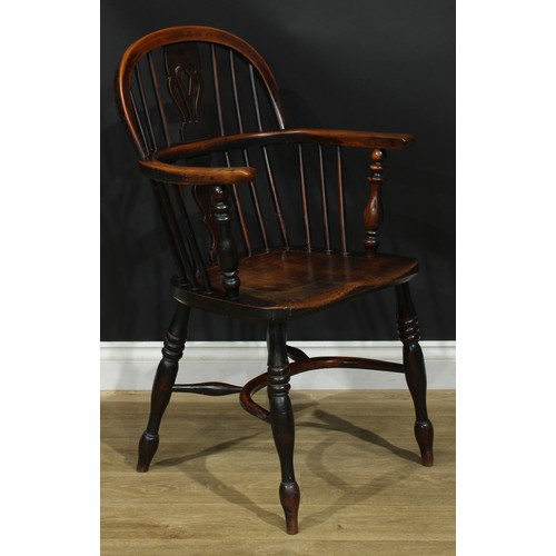 1374 - A pair of 19th century yew, elm and ash Windsor elbow chairs, each with a low hoop back, shaped and ... 