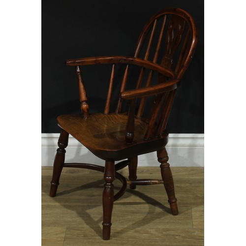 1009 - A 19th century yew and elm miniature Windsor elbow chair, hoop back, shaped and pierced splat, turne... 