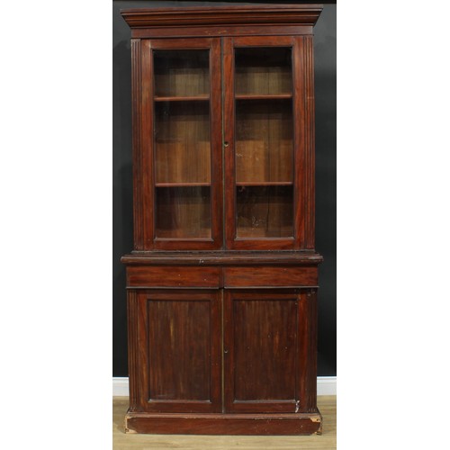 928 - A 19th century mahogany library bookcase, moulded cornice above a pair of glazed doors enclosing she... 