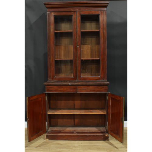 928 - A 19th century mahogany library bookcase, moulded cornice above a pair of glazed doors enclosing she... 