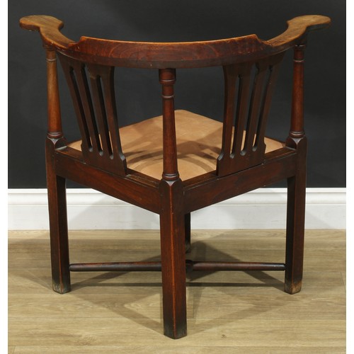 1002 - A 19th century vernacular ash, beech and elm corner chair, shaped and pierced splats, turned support... 