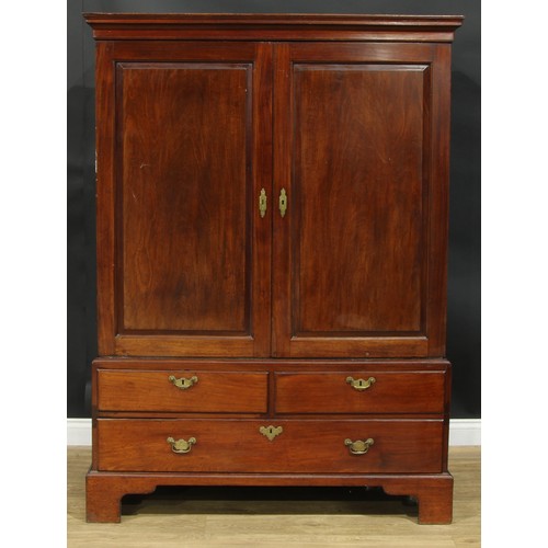 1223 - A George III mahogany linen press, outswept cornice above a pair of raised and fielded panel doors e... 