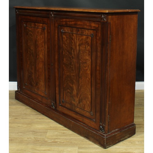 929 - A 19th century mahogany low press cupboard, rectangular top with moulded edge above a pair of panel ... 