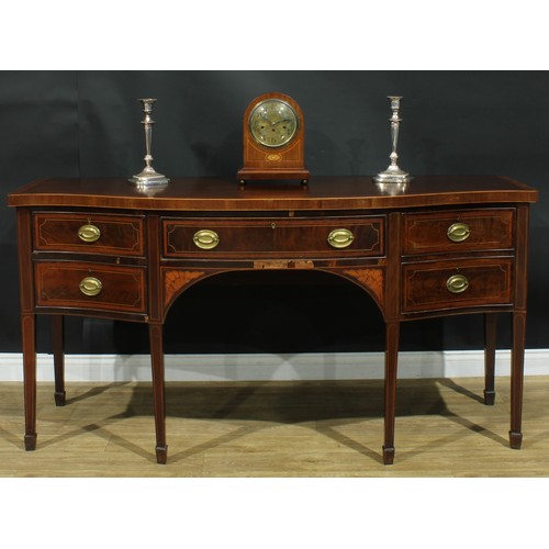 1445 - A Sheraton Revival satinwood crossbanded mahogany serpentine sideboard, slightly oversailing top abo... 