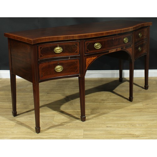 1445 - A Sheraton Revival satinwood crossbanded mahogany serpentine sideboard, slightly oversailing top abo... 