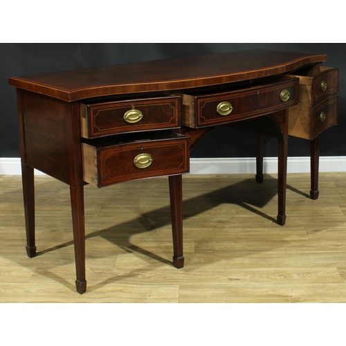 1445 - A Sheraton Revival satinwood crossbanded mahogany serpentine sideboard, slightly oversailing top abo... 