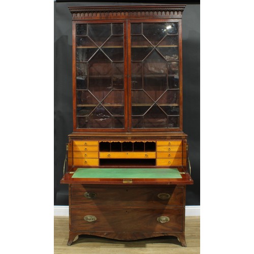 1226 - A George III mahogany secretaire bookcase, outswept cornice above a pair of astragal glazed doors en... 