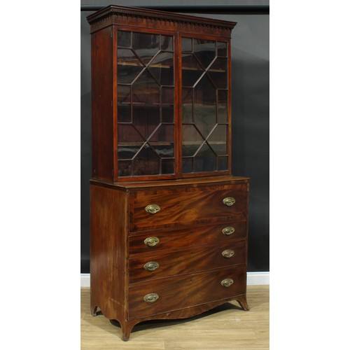 1226 - A George III mahogany secretaire bookcase, outswept cornice above a pair of astragal glazed doors en... 