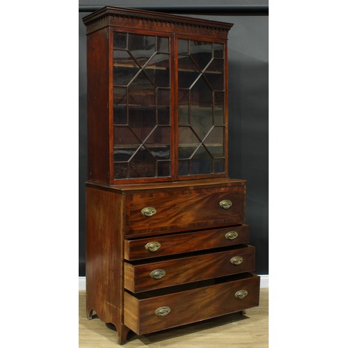 1226 - A George III mahogany secretaire bookcase, outswept cornice above a pair of astragal glazed doors en... 