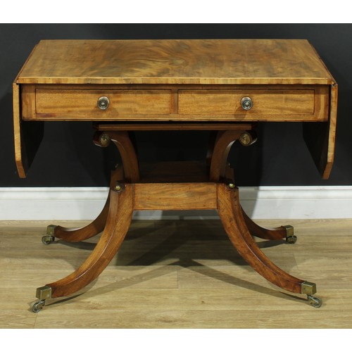 934 - A 19th century mahogany sofa table, canted rectangular top with fall leaves above a pair of frieze d... 