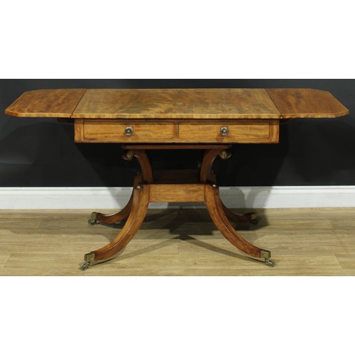 934 - A 19th century mahogany sofa table, canted rectangular top with fall leaves above a pair of frieze d... 