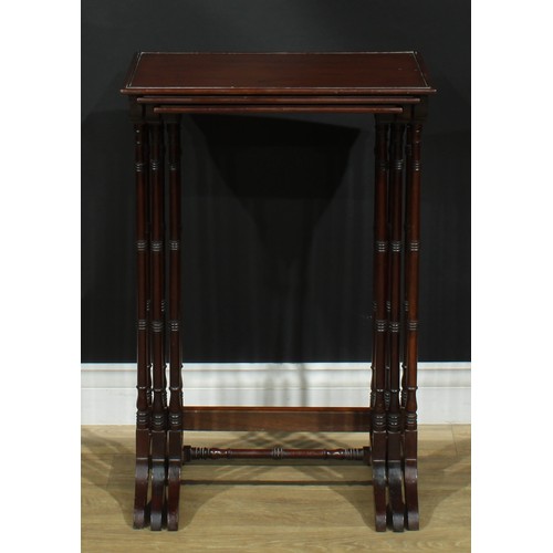 1370 - A nest of three George III Revival mahogany occasional tables, each with a rectangular top, turned s... 