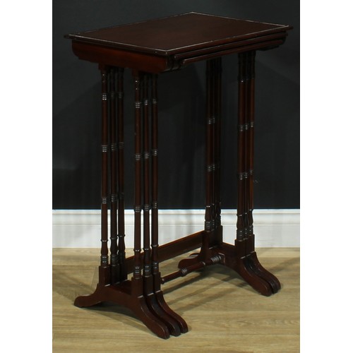 1370 - A nest of three George III Revival mahogany occasional tables, each with a rectangular top, turned s... 